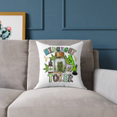 “White throw pillow on grey couch with cannabis-themed Midnight Toker design”