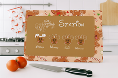 Cutting board with 'Hot Chocolate Station' design on a kitchen counter