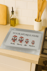 Personalized penguin family mat with customizable names on a kitchen counter.