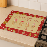 Personalized gingerbread-themed placemat on a kitchen counter