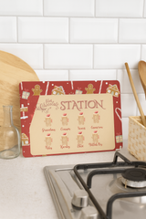 Hot chocolate station sign on a kitchen counter with a white tiled wall background