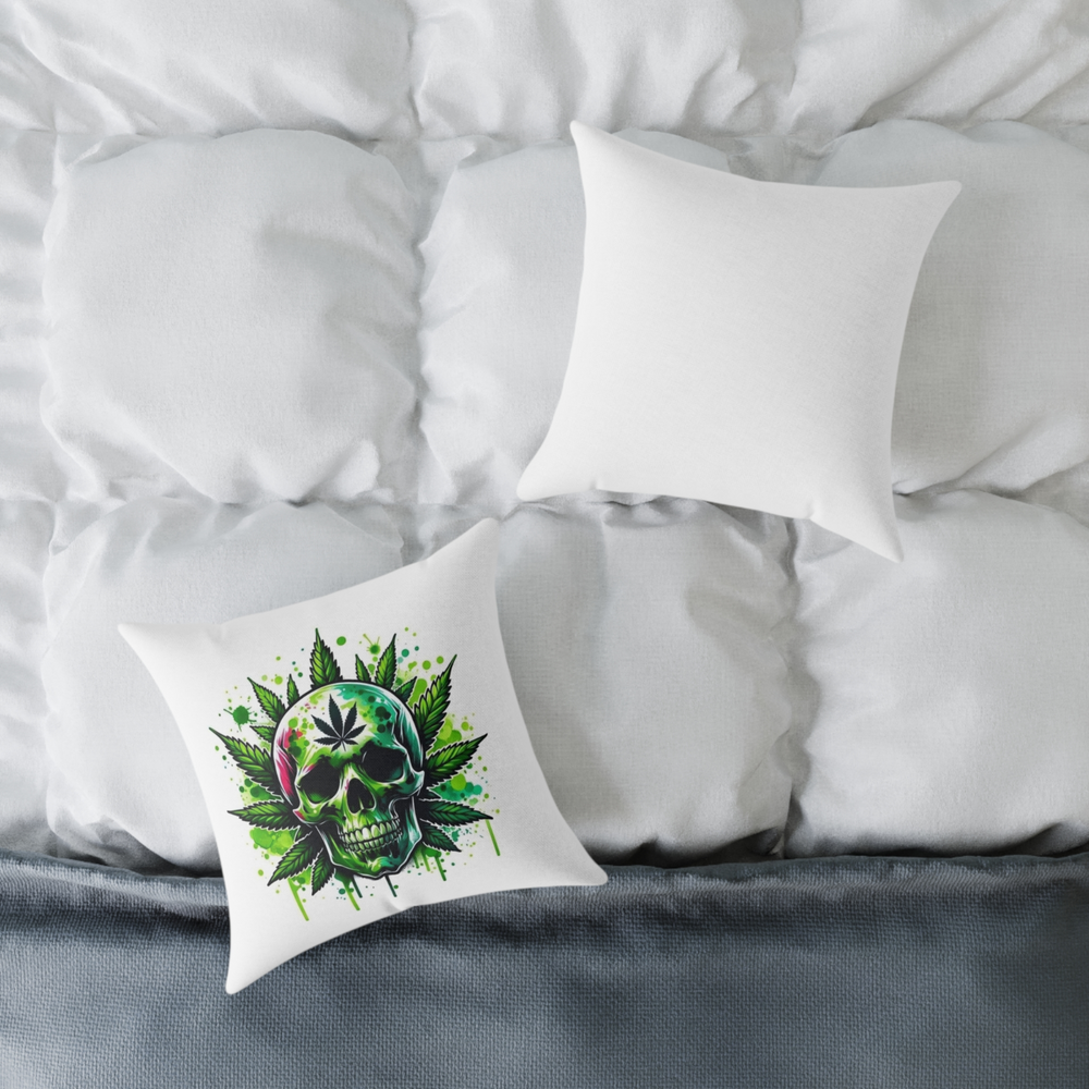 “Skull pillow with weed leaf pattern placed on white bedspread”
