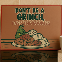 Glass Chopping Board with Grinch design and text 'Don't be a Grinch, pass the cookies' on a Kitchen worktop