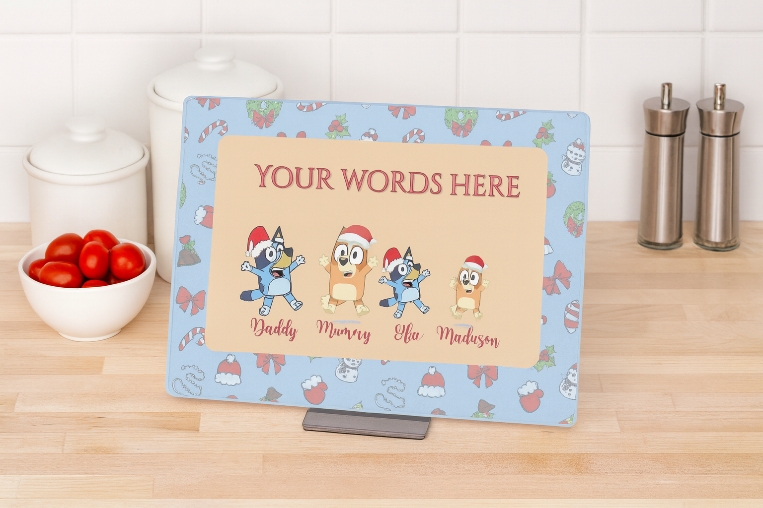 Personalized placemat with cartoon characters and customizable text on a kitchen counter.