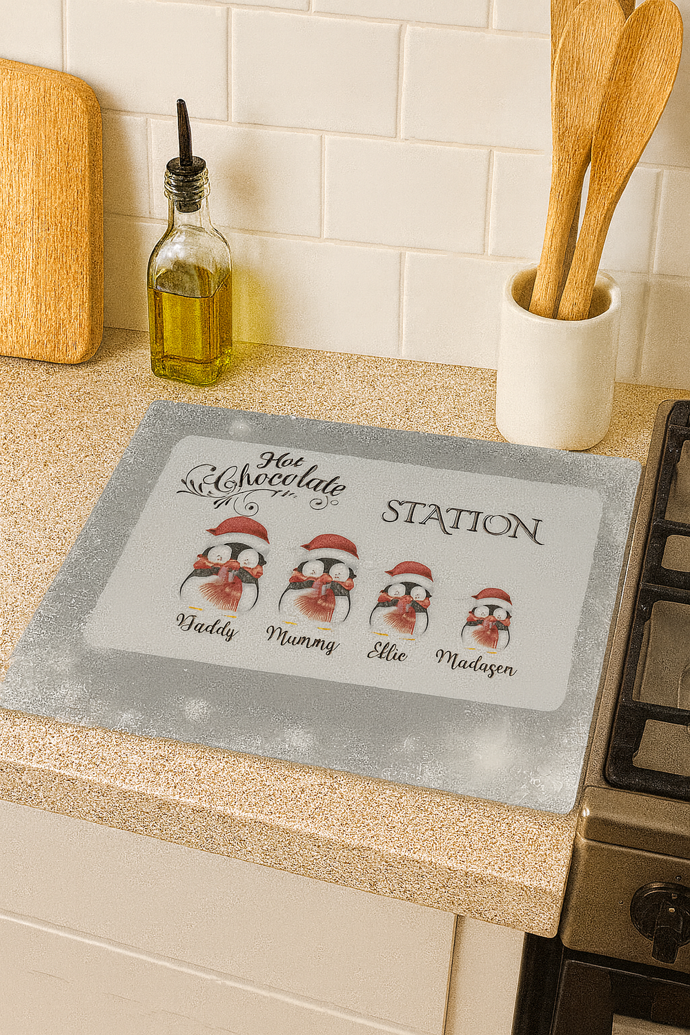 Kitchen countertop with a personalized penguin-themed placemat featuring family names.