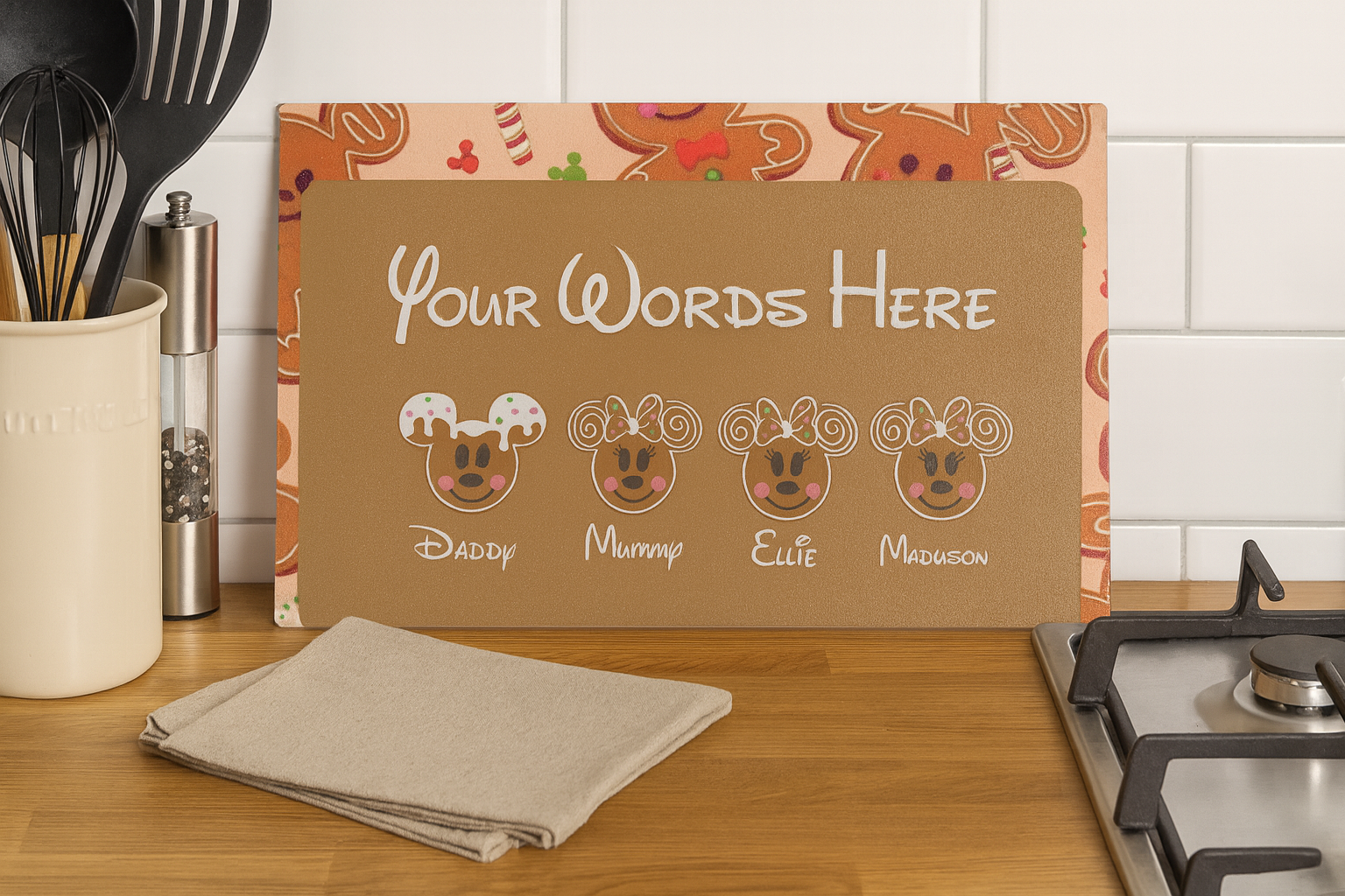 Personalized gingerbread family design on a kitchen counter with text 'Your Words Here'.