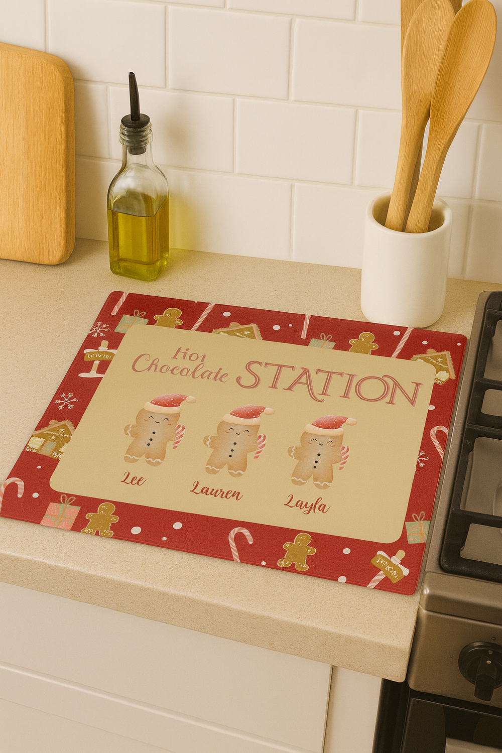 Hot chocolate station mat on a kitchen counter with a stove and wooden utensils in the background.