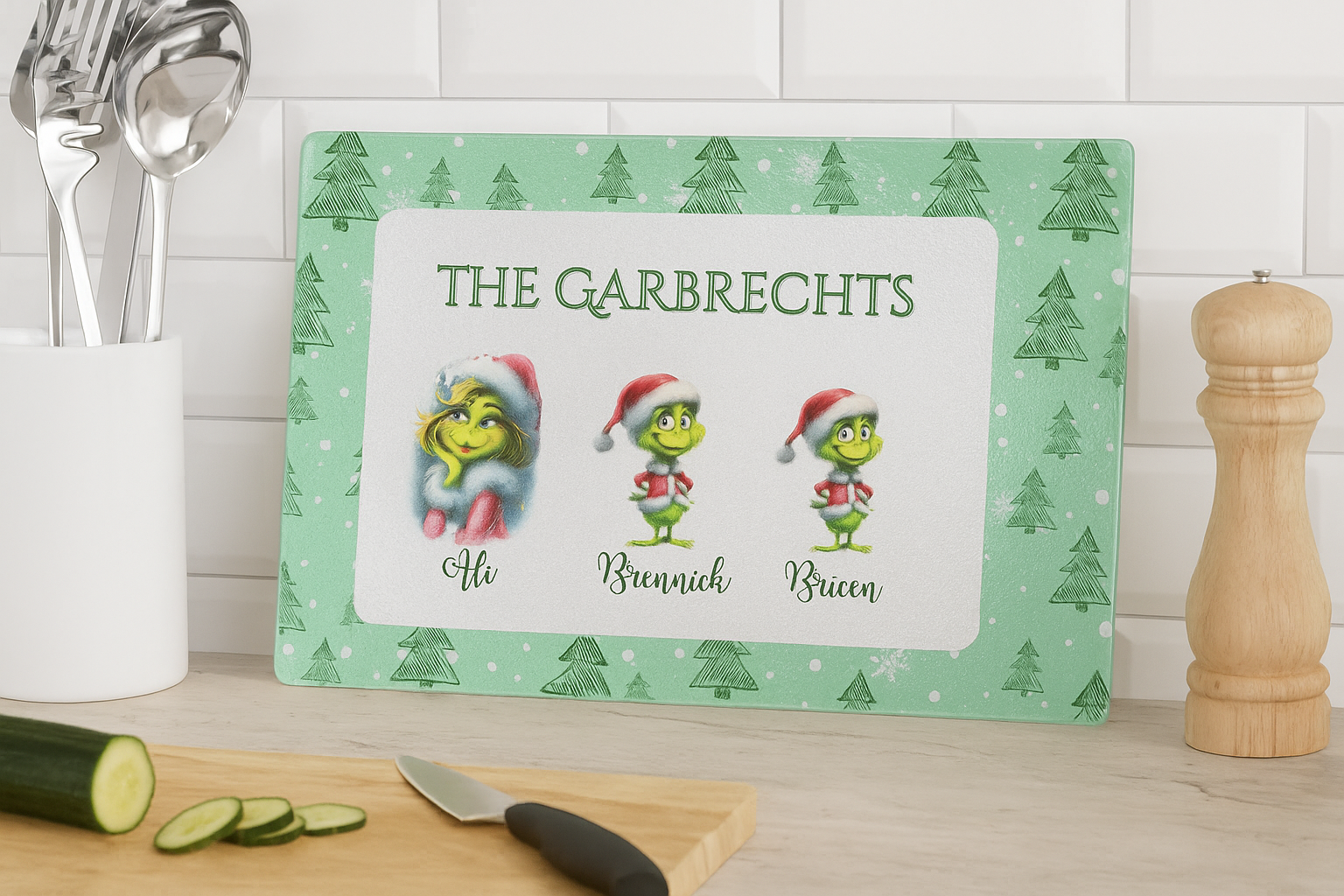 Personalized cutting board with Grinch design and family names on a kitchen counter.