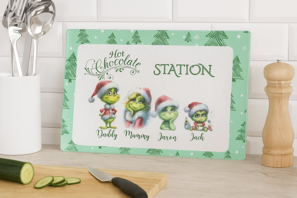 Christmas-themed hot chocolate station sign with cartoon characters on a kitchen counter.