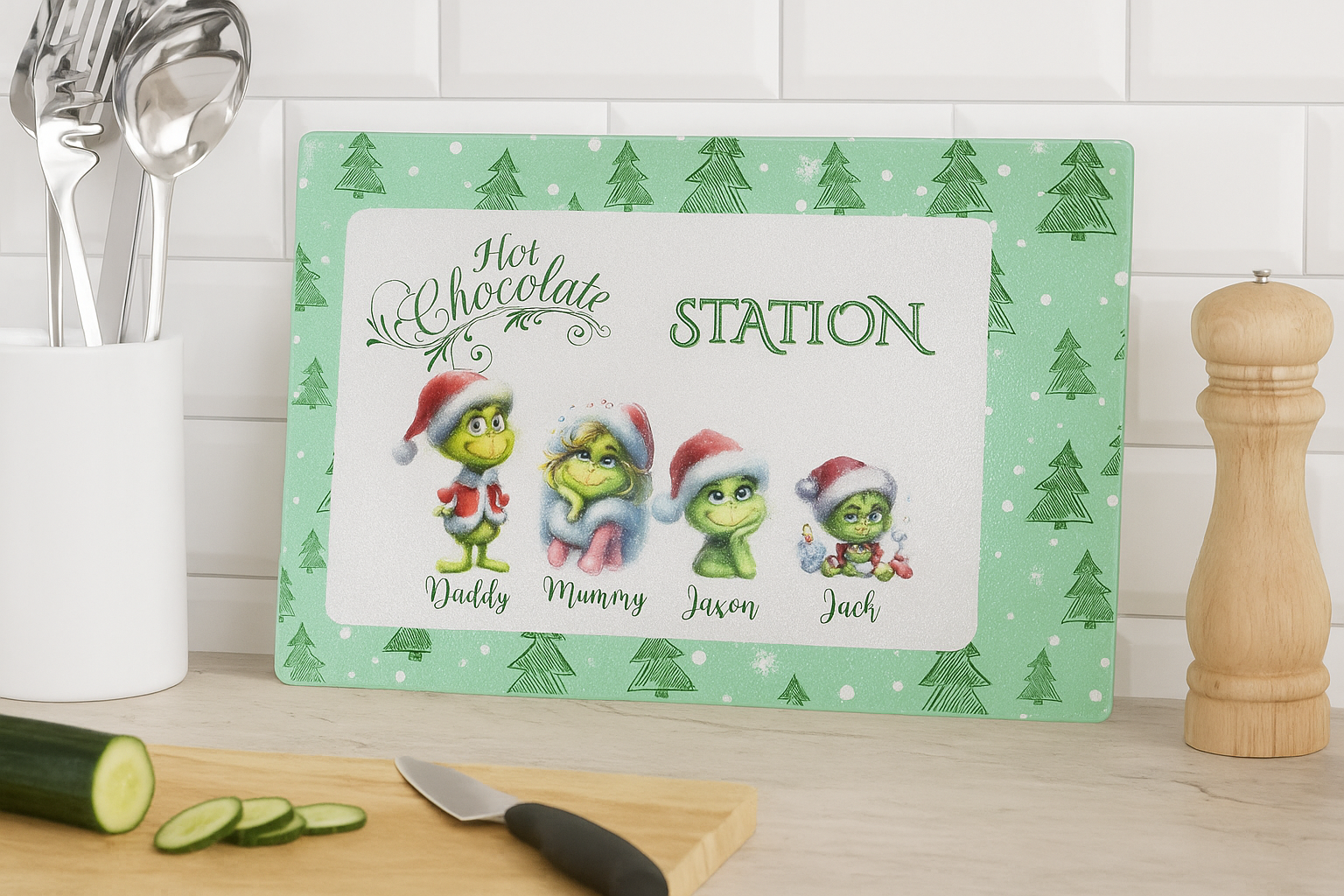 Personalized Grinch-themed cutting board with family names on a kitchen counter.