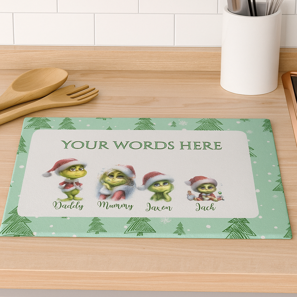 Personalized Christmas mat with cartoon characters on a kitchen counter.