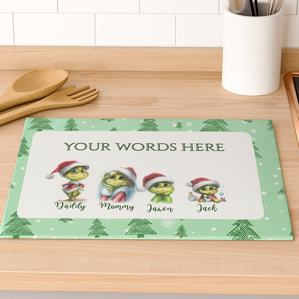 Personalized Christmas mat with cartoon characters on a kitchen counter.