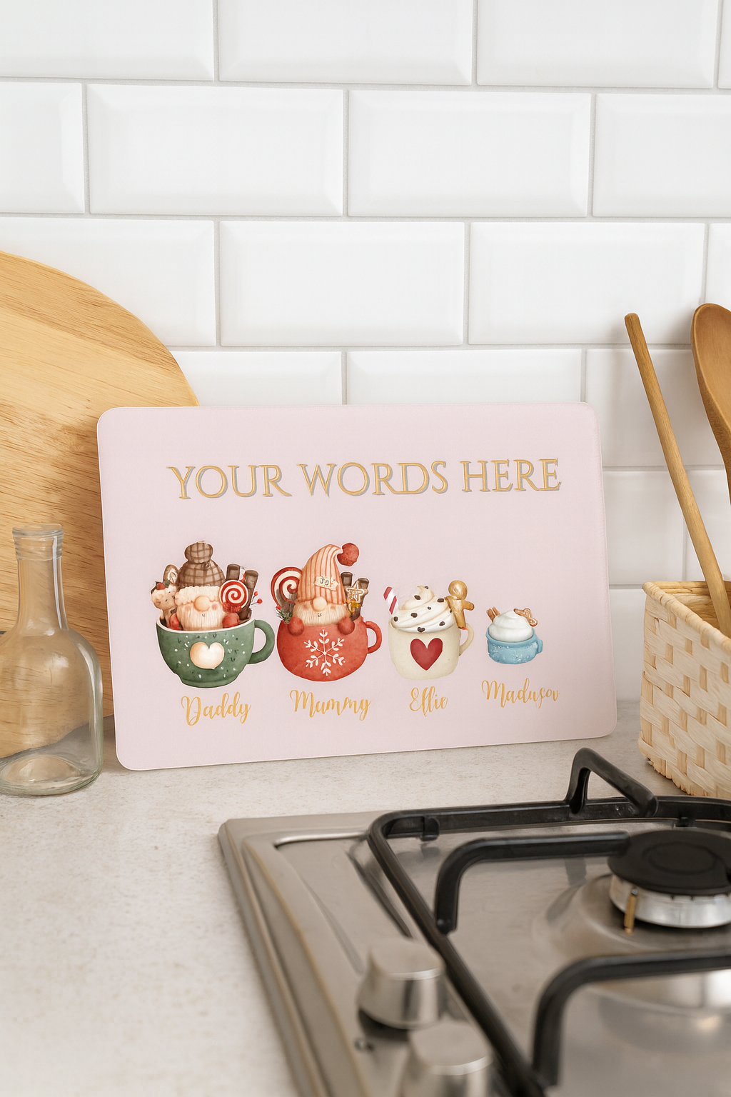 Decorative sign with cartoon characters and text space on a kitchen counter.